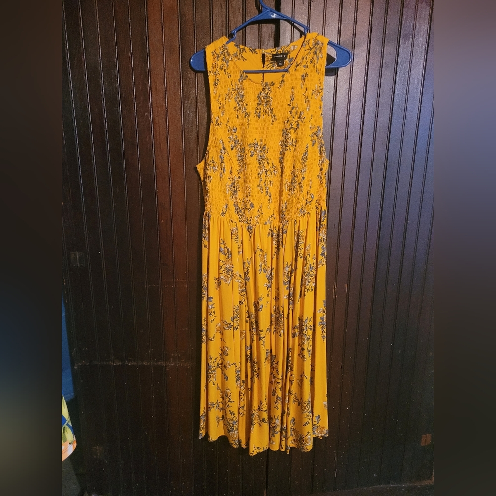 Torrid size 1 yellow dress with floral pattern.